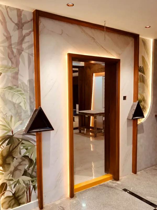 A lit timber frame against botanical wallpaper.