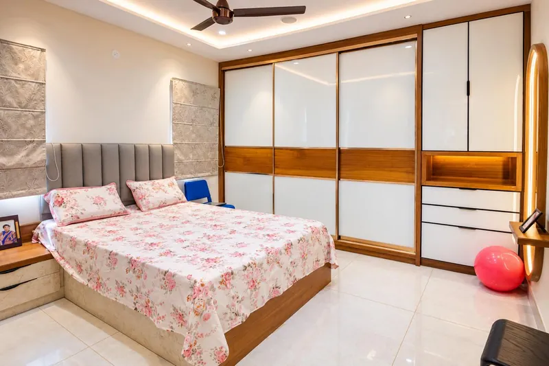A white glass wardrobe banded in timber.