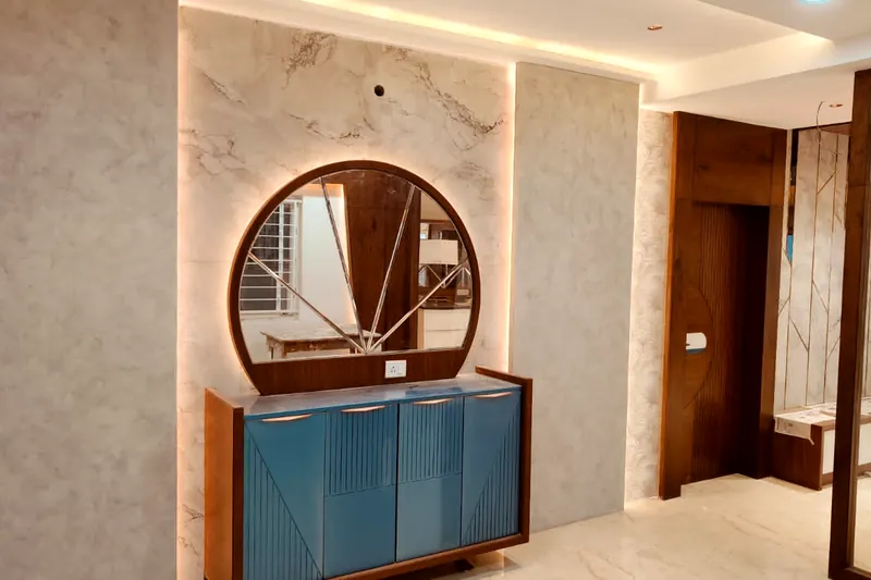 A round mirror over blue lacquer, set into marble.
