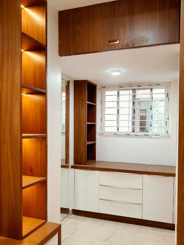 Open timber shelves, lit from within.